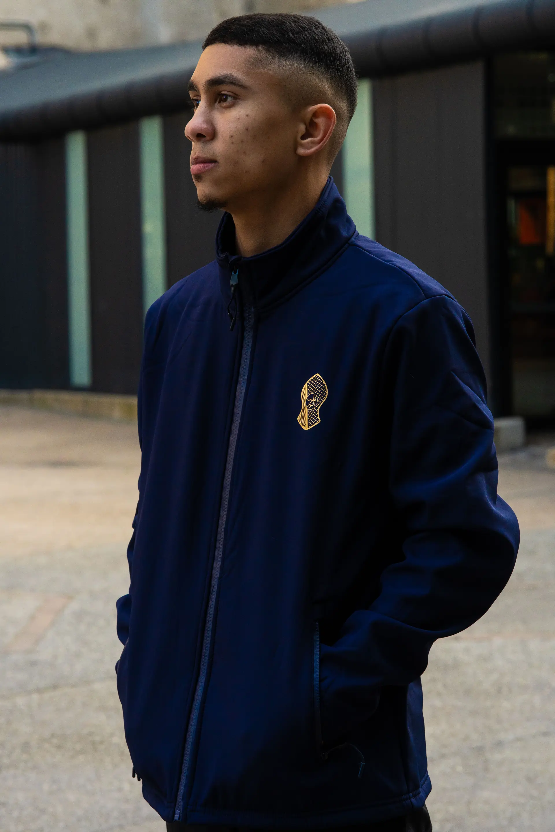 Navy soft shell jacket with the logo on the chest