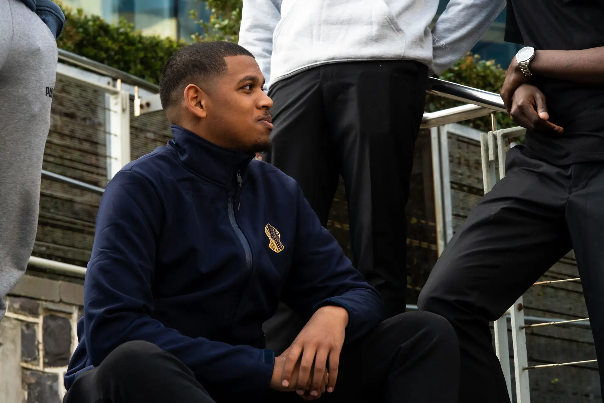 Navy soft shell worn on the steps