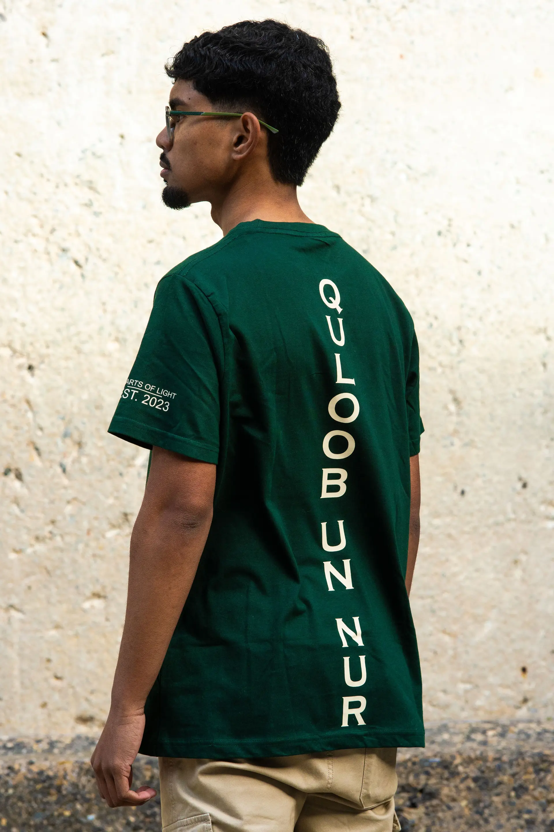 Forest green t-shirt from behind, showing the back print