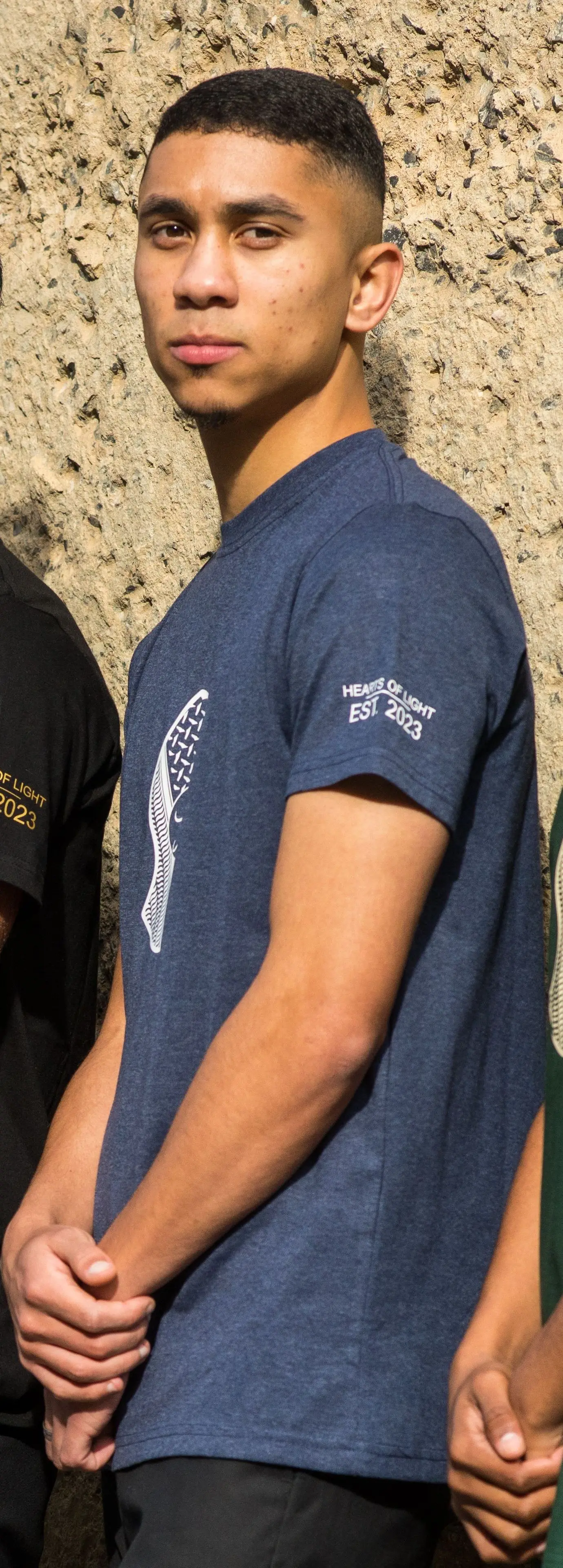 Navy t-shirt worn in the group line-up