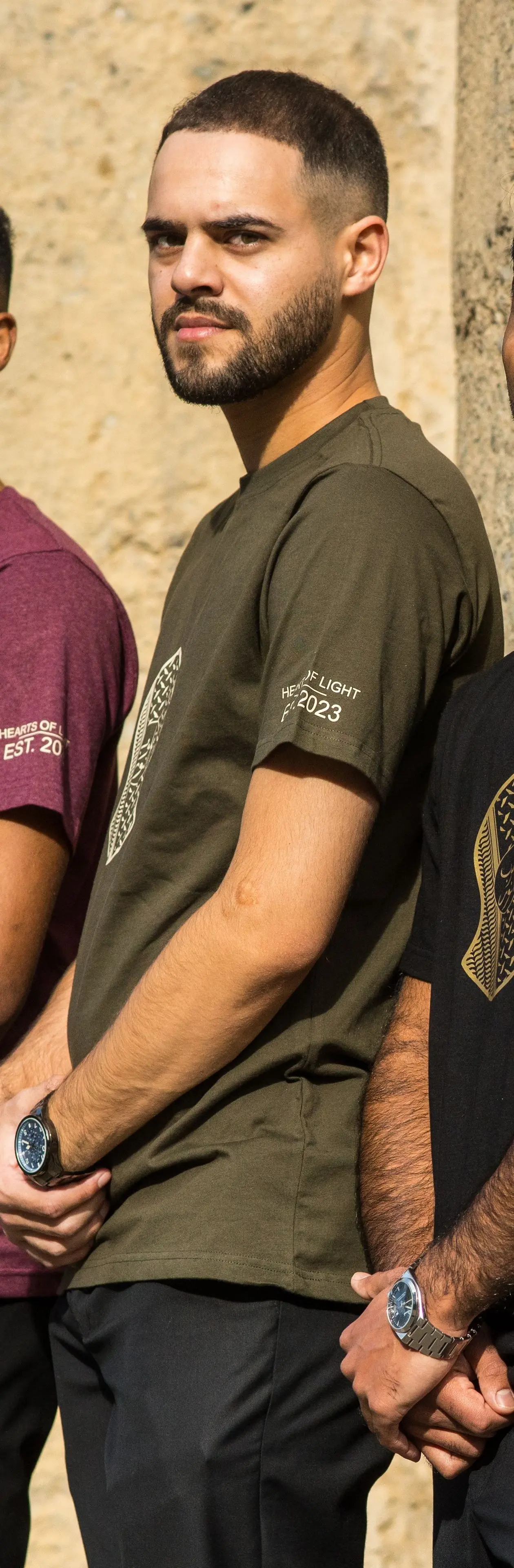 Olive t-shirt worn in the group line-up